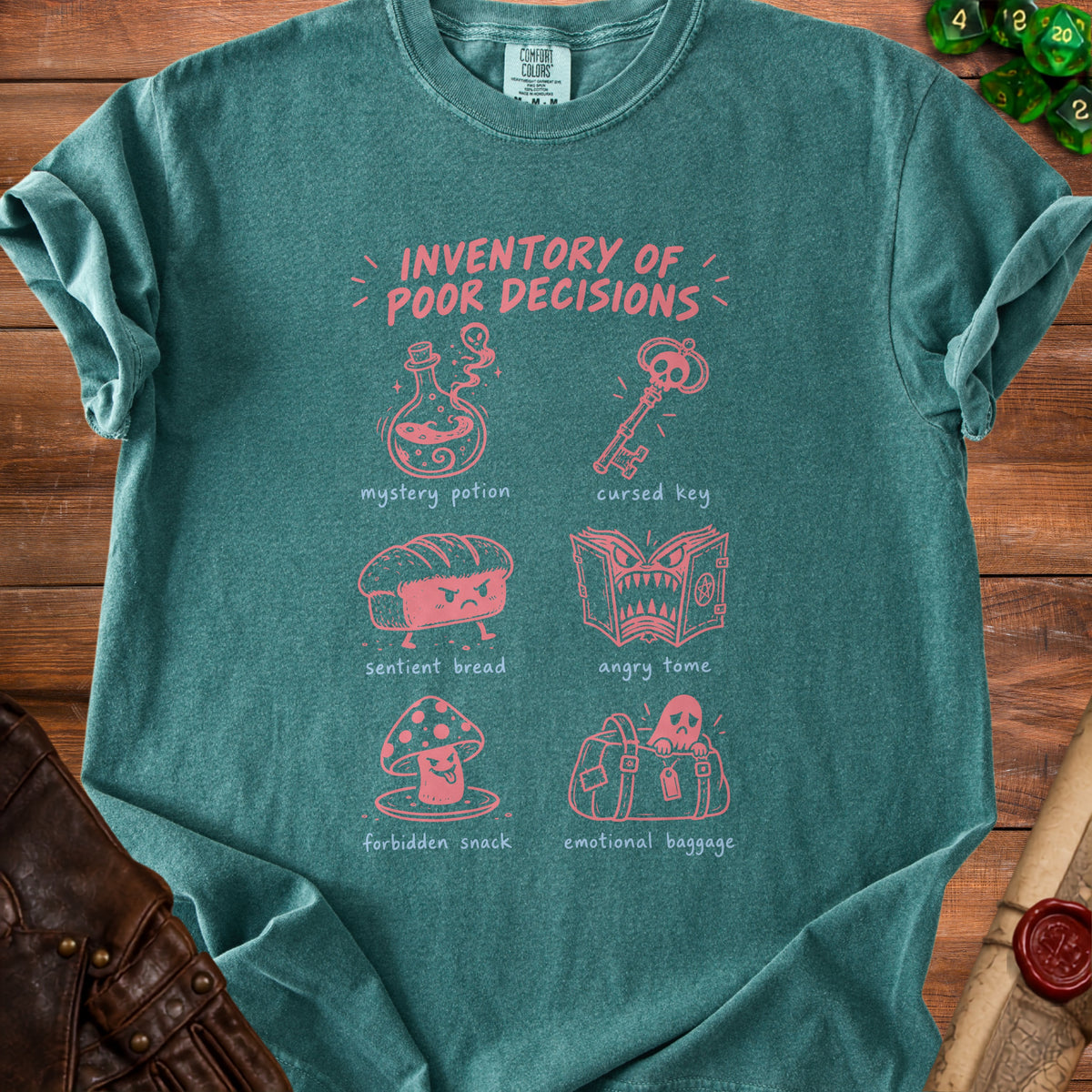 Teal t-shirt with pink graphics: "Inventory of Poor Decisions" and illustrations.