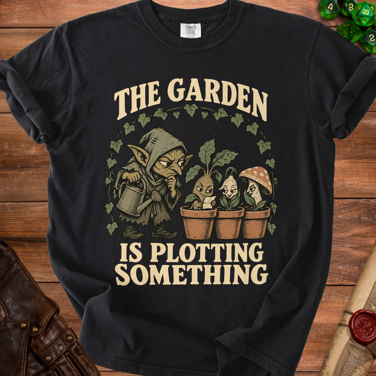 Goblin watering plants with text "The Garden Is Plotting Something"