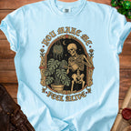 Skeleton watering plants with text "You Make Me Feel Alive."
