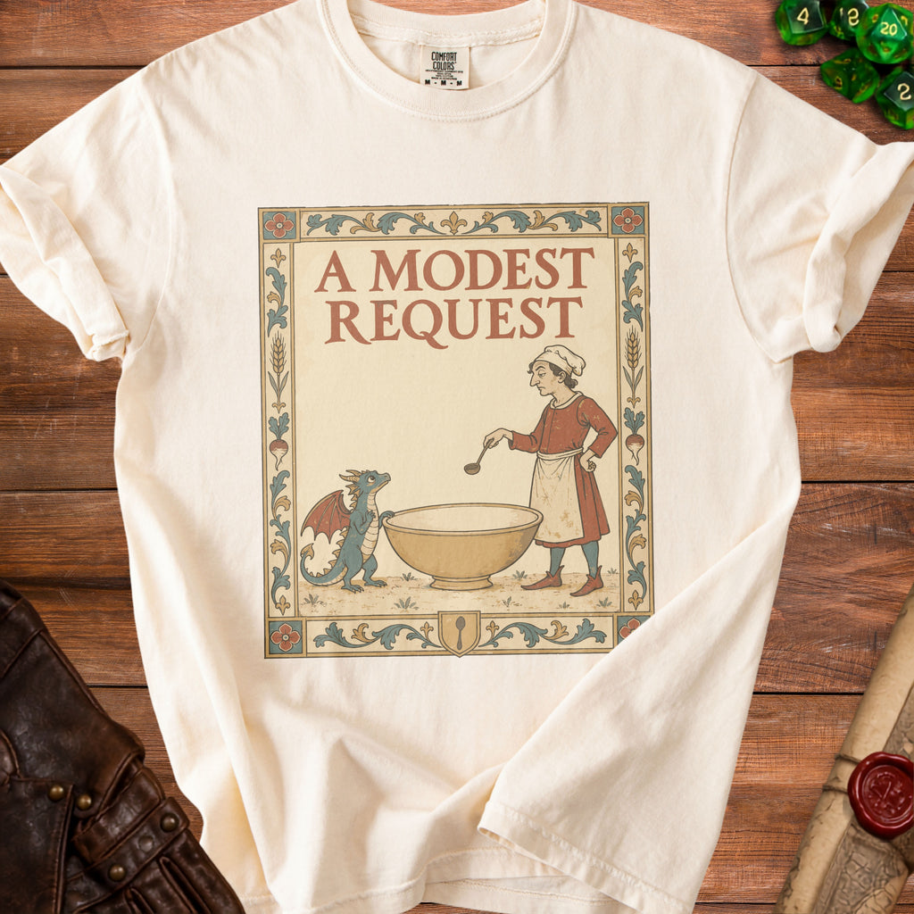 Cream t-shirt with a vintage illustration of a cook and a dragon, reading "A MODEST REQUEST".