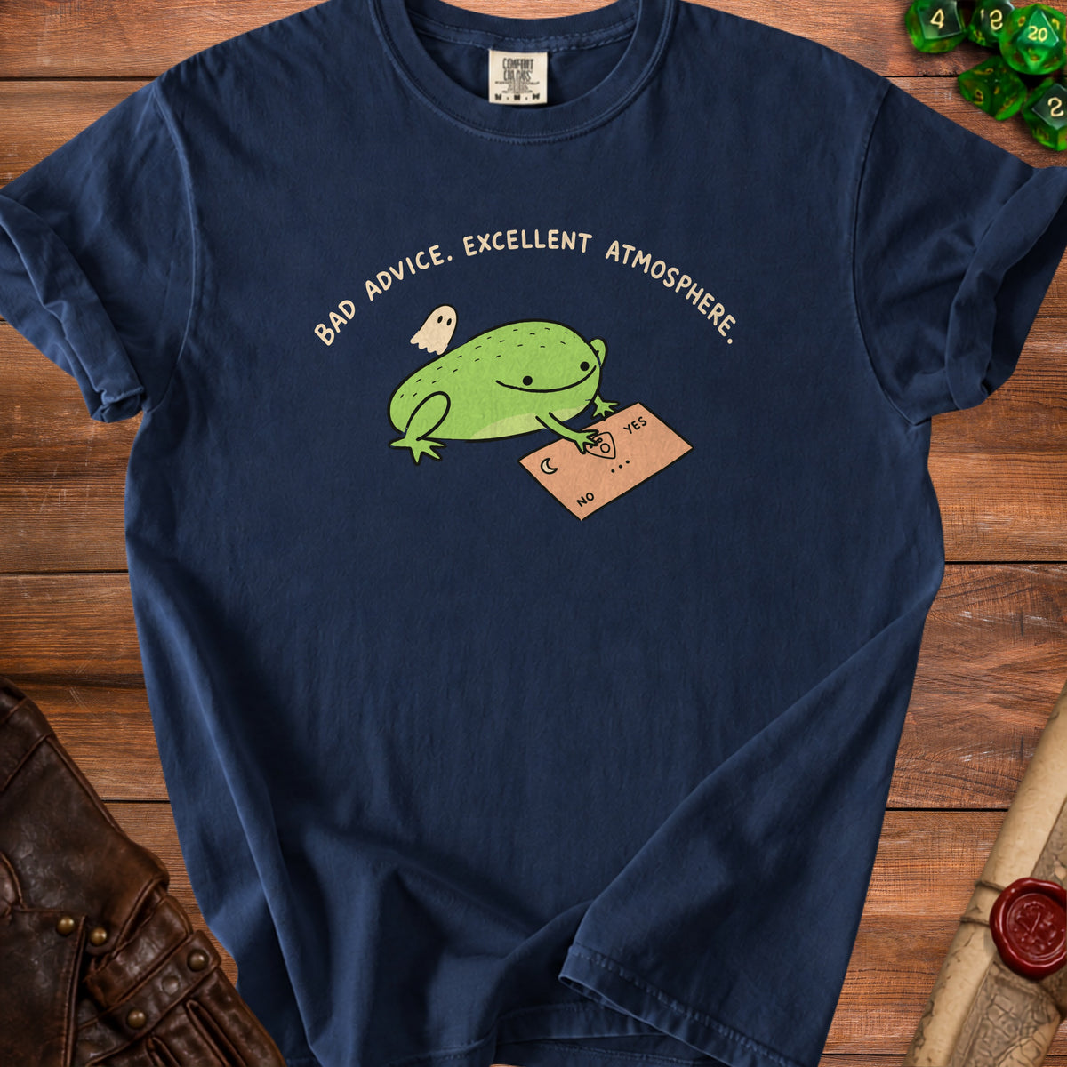 Dark blue t-shirt with a frog, ghost, and ouija board graphic reading "Bad advice. Excellent atmosphere."