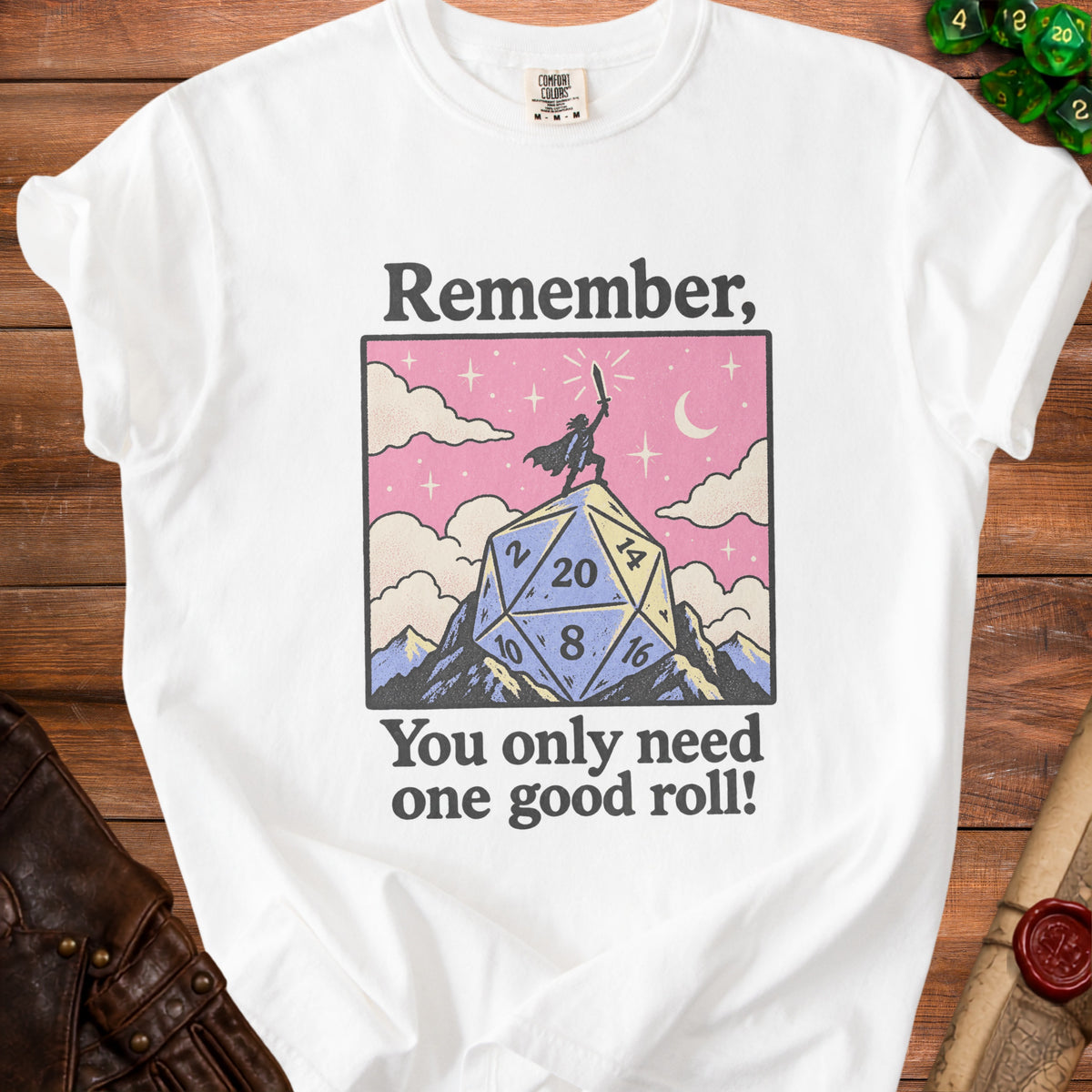 White t-shirt with "Remember, You only need one good roll!" text and a d20 die.