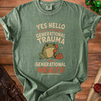 Green t-shirt with text "YES HELLO I'D LIKE TO EXCHANGE MY GENERATIONAL TRAUMA FOR GENERATIONAL WEALTH" and a frog on the phone.
