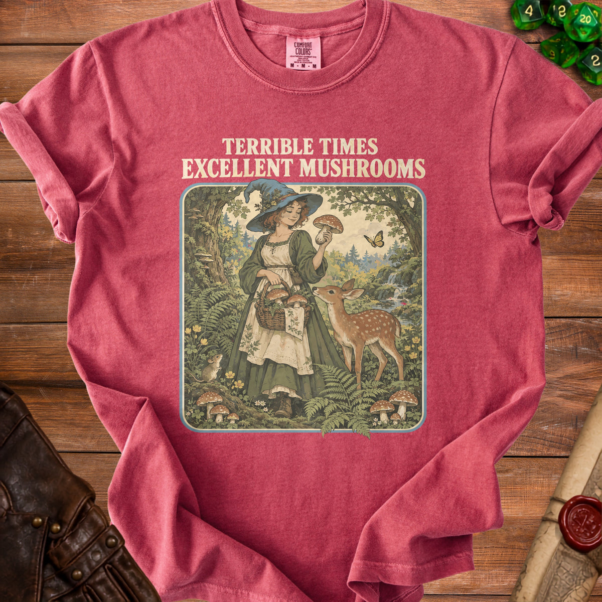 T-shirt with "TERRIBLE TIMES EXCELLENT MUSHROOMS" text and woodland witch illustration.