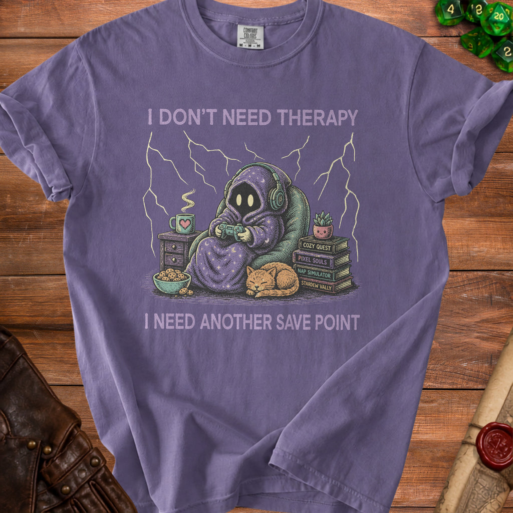 Purple t-shirt graphic with text "I DON'T NEED THERAPY I NEED ANOTHER SAVE POINT".