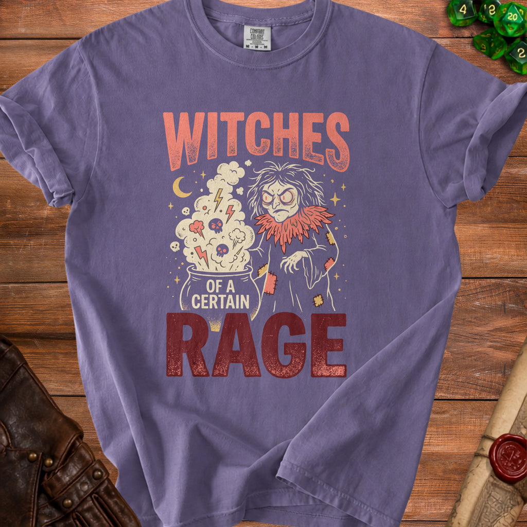 Purple t-shirt with graphic text "Witches of a Certain Rage" and witch illustration.