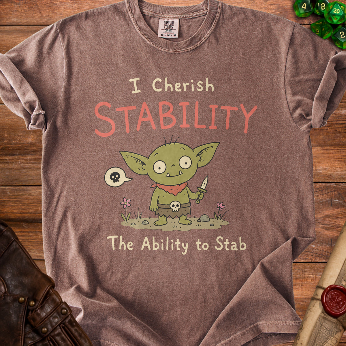 Brown t-shirt with "I Cherish Stability The Ability to Stab" and a goblin holding a dagger.