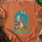 Orange t-shirt with illustration of a bard playing lute before a dragon, surrounded by treasure.