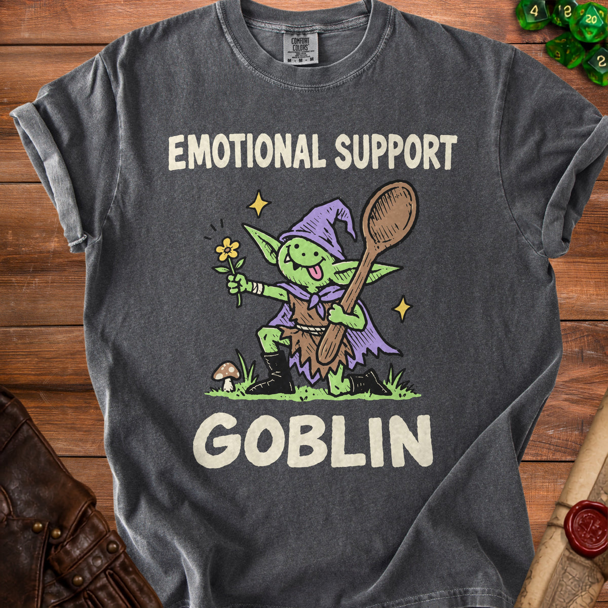 T-shirt with "Emotional Support Goblin" text and cartoon goblin character holding a flower and spoon.