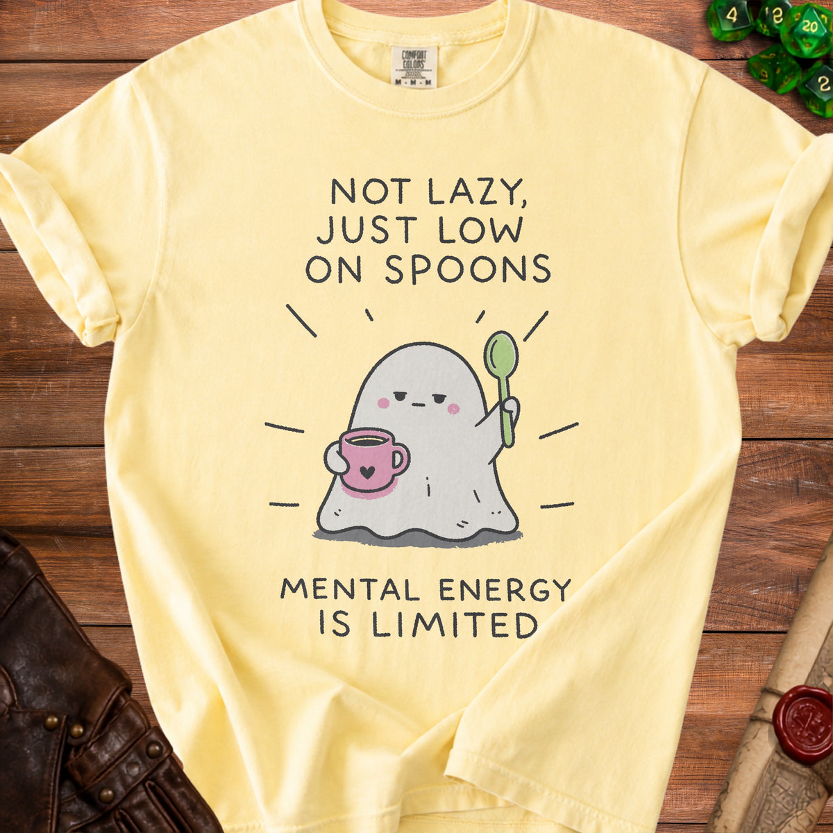 Yellow t-shirt with a ghost holding coffee and spoon, text "NOT LAZY, JUST LOW ON SPOONS MENTAL ENERGY IS LIMITED".