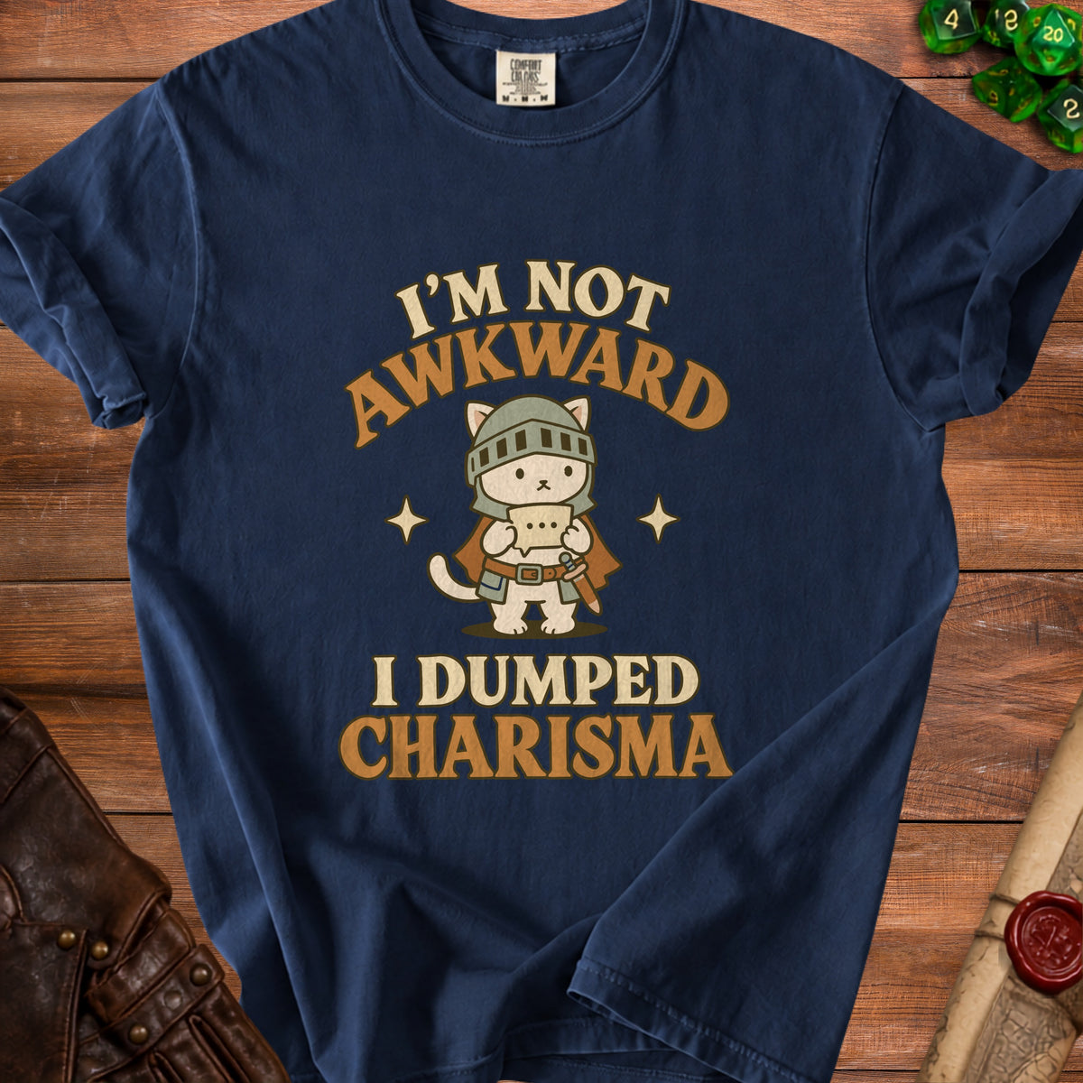 Navy t-shirt with a cat knight graphic and text "I'M NOT AWKWARD I DUMPED CHARISMA".