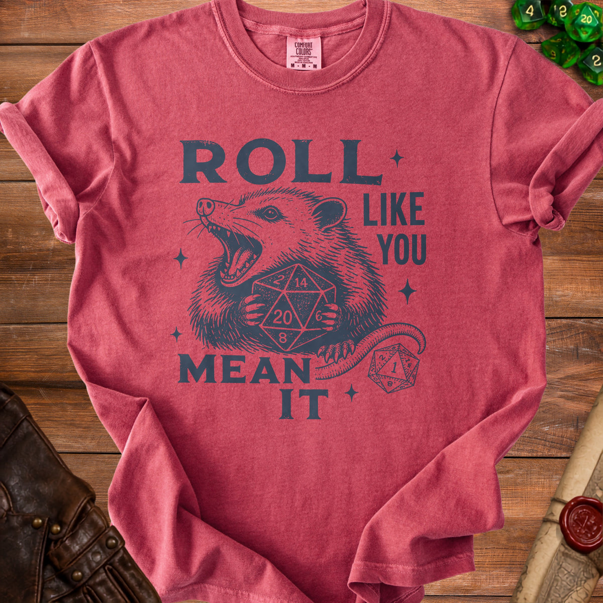 Possum graphic t-shirt with "Roll Like You Mean It" text and dice.