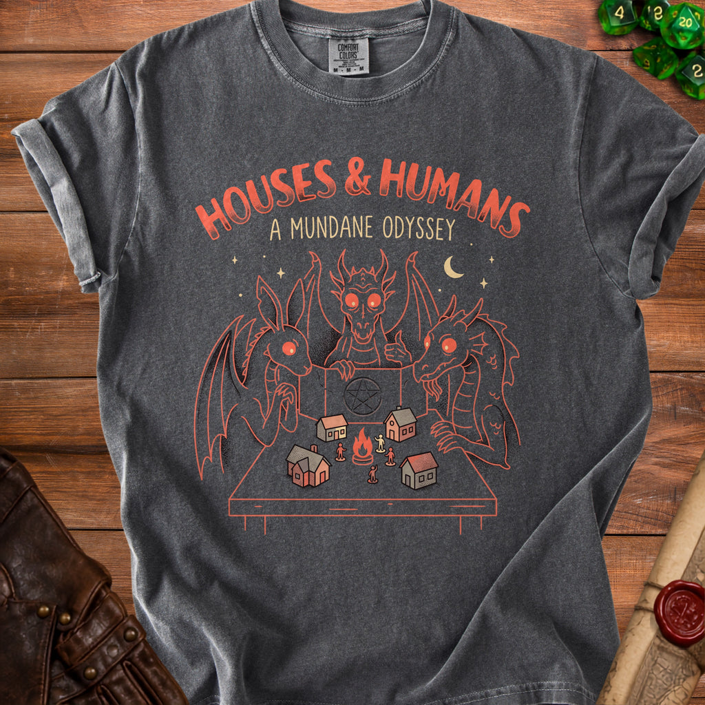 T-shirt with "HOUSES & HUMANS A MUNDANE ODYSSEY" and dragons playing a tabletop game.