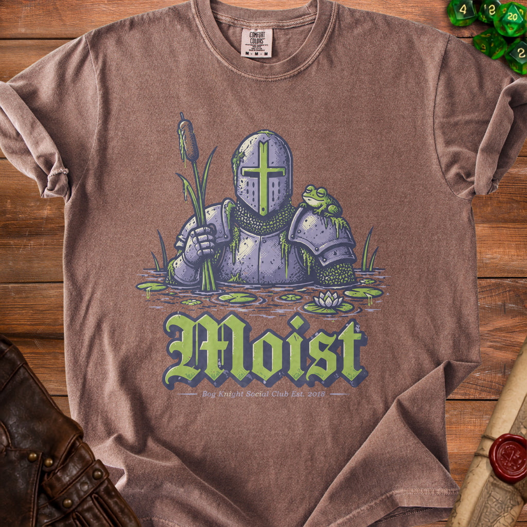 Knight in armor holding reeds with frog on shoulder, text "Moist" below.