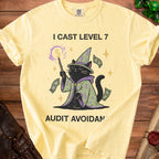 Yellow t-shirt with a black cat wizard and the text "I CAST LEVEL 7 AUDIT AVOIDAN".