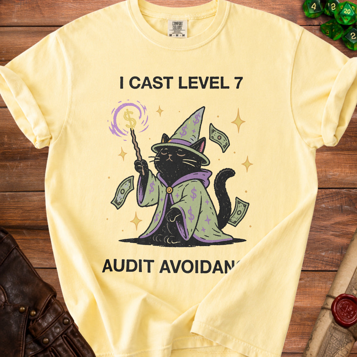 Yellow t-shirt with a black cat wizard and the text "I CAST LEVEL 7 AUDIT AVOIDAN".