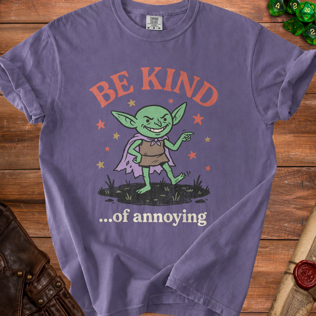 Purple t-shirt with a cartoon goblin graphic saying "BE KIND ...of annoying."