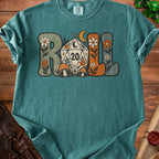 Teal t-shirt with "ROLL" text, dice, mushrooms, and flowers graphic.