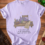 Lilac t-shirt with illustration of sleeping wizard and "I cast minor spell on my responsibilities" text.