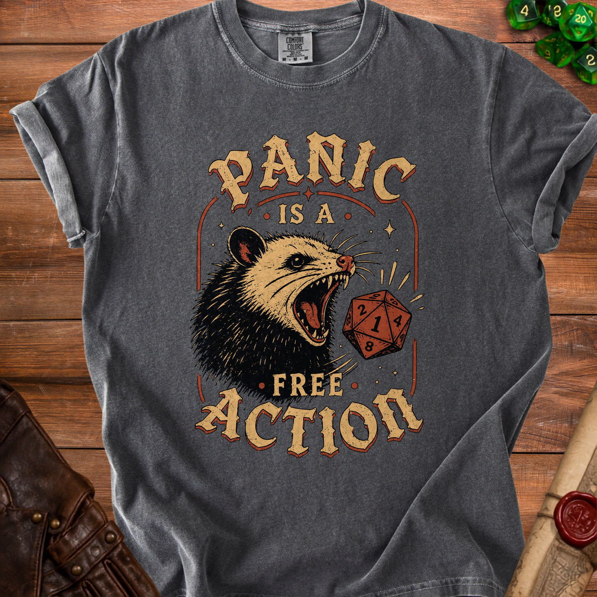 Charcoal t-shirt with possum and dice graphic, "PANIC IS A FREE ACTION".