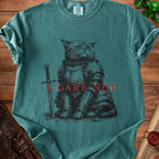 Green t-shirt with print of cat in armor and text "I CARE NOT".