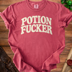Red t-shirt with "POTION FUCKER" in off-white text.