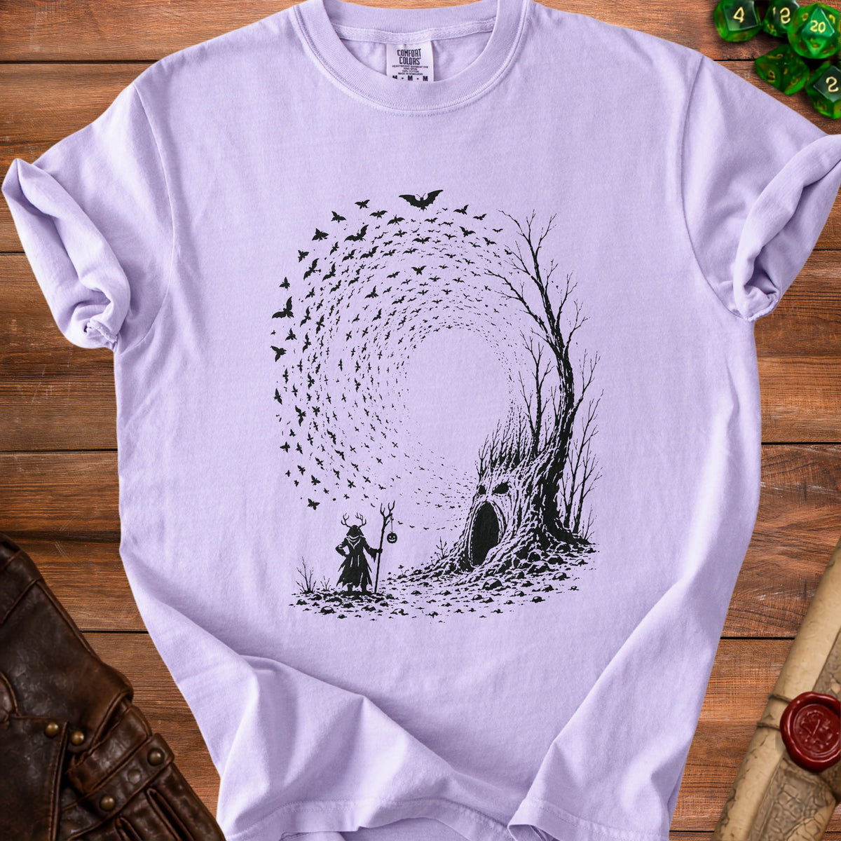Black bats swirl around a tree with a face, near a figure holding a pumpkin staff.