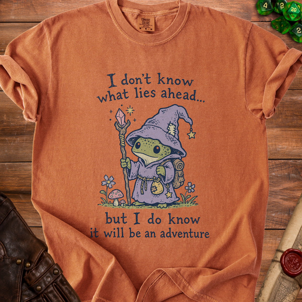 T-shirt with frog wizard graphic and text "I don't know what lies ahead... but I do know it will be an adventure"