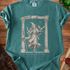 T-shirt with illustration of a witch and owl, with text "TRYING TO MAINTAIN CONCENTRATION".