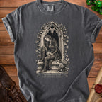 Dark gray t-shirt with an elf in a hooded cloak sitting by an arched window, text reads "PASSED STEALTH FAILED SMALL TALK."