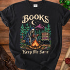 Skeleton reading by campfire with cat and books, "Books Keep Me Sane" text.