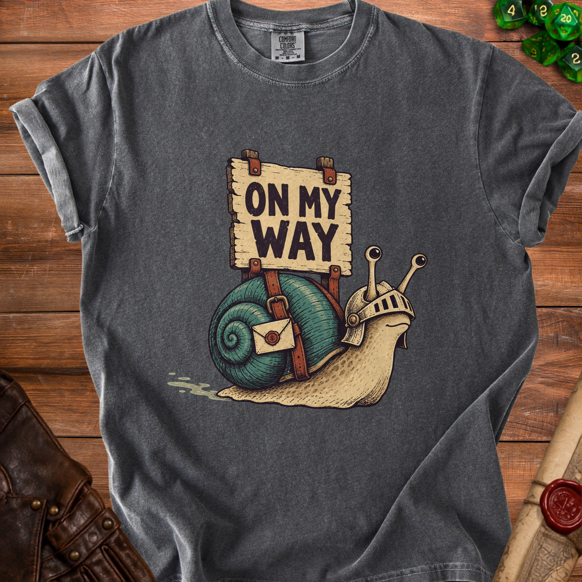 T-shirt with a knight snail wearing armor carrying a letter and a sign reading "ON MY WAY".