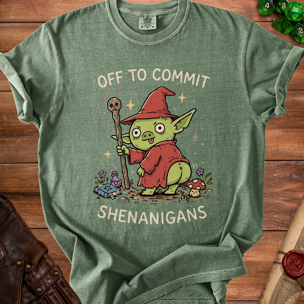 Green t-shirt with a cartoon goblin holding a staff and text "OFF TO COMMIT SHENANIGANS".
