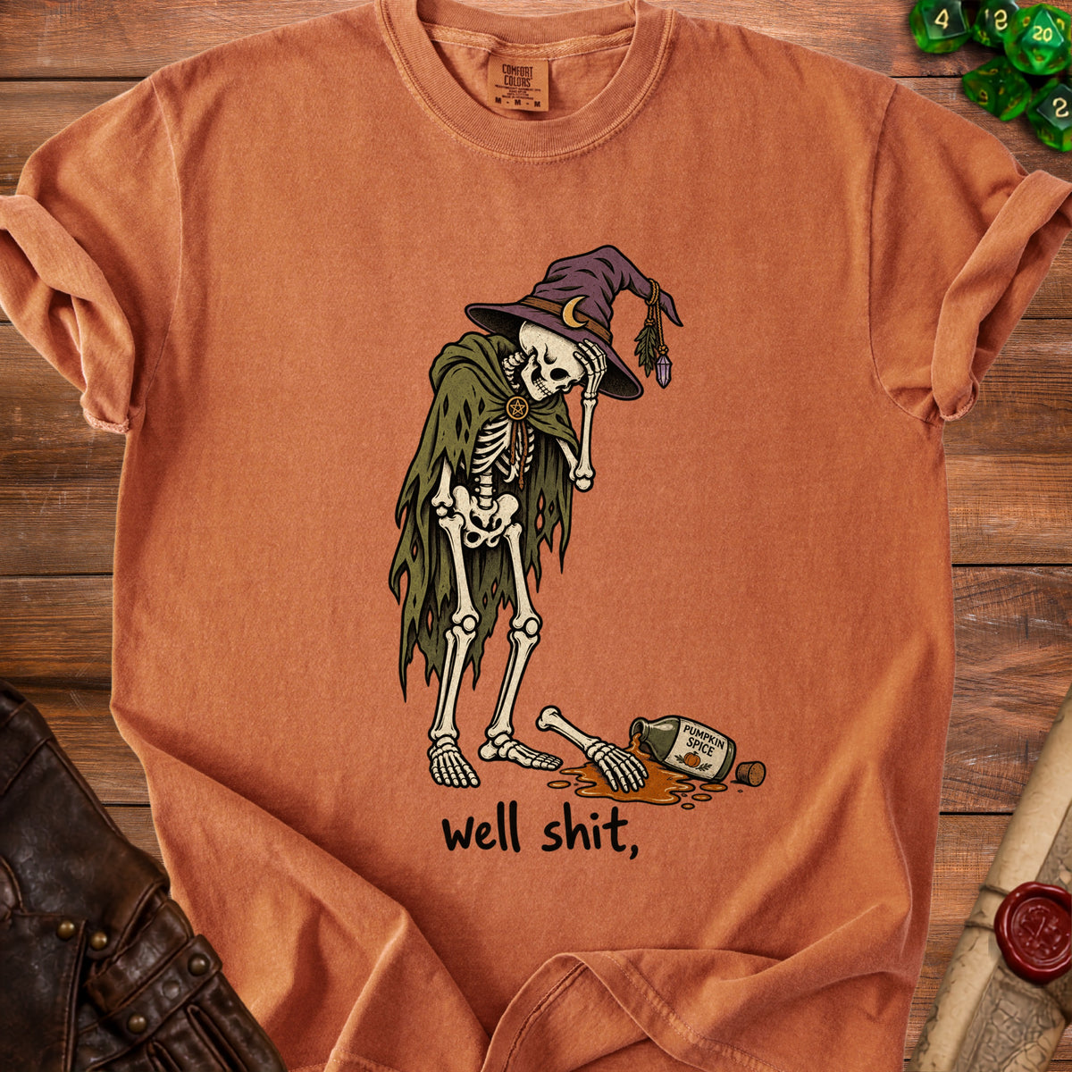 Skeleton wearing a wizard hat and cloak, spilling pumpkin spice and saying "well shit,".