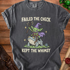 Dark gray t-shirt with a goblin riding a frog, text "Failed the Check Kept the Whimsy."