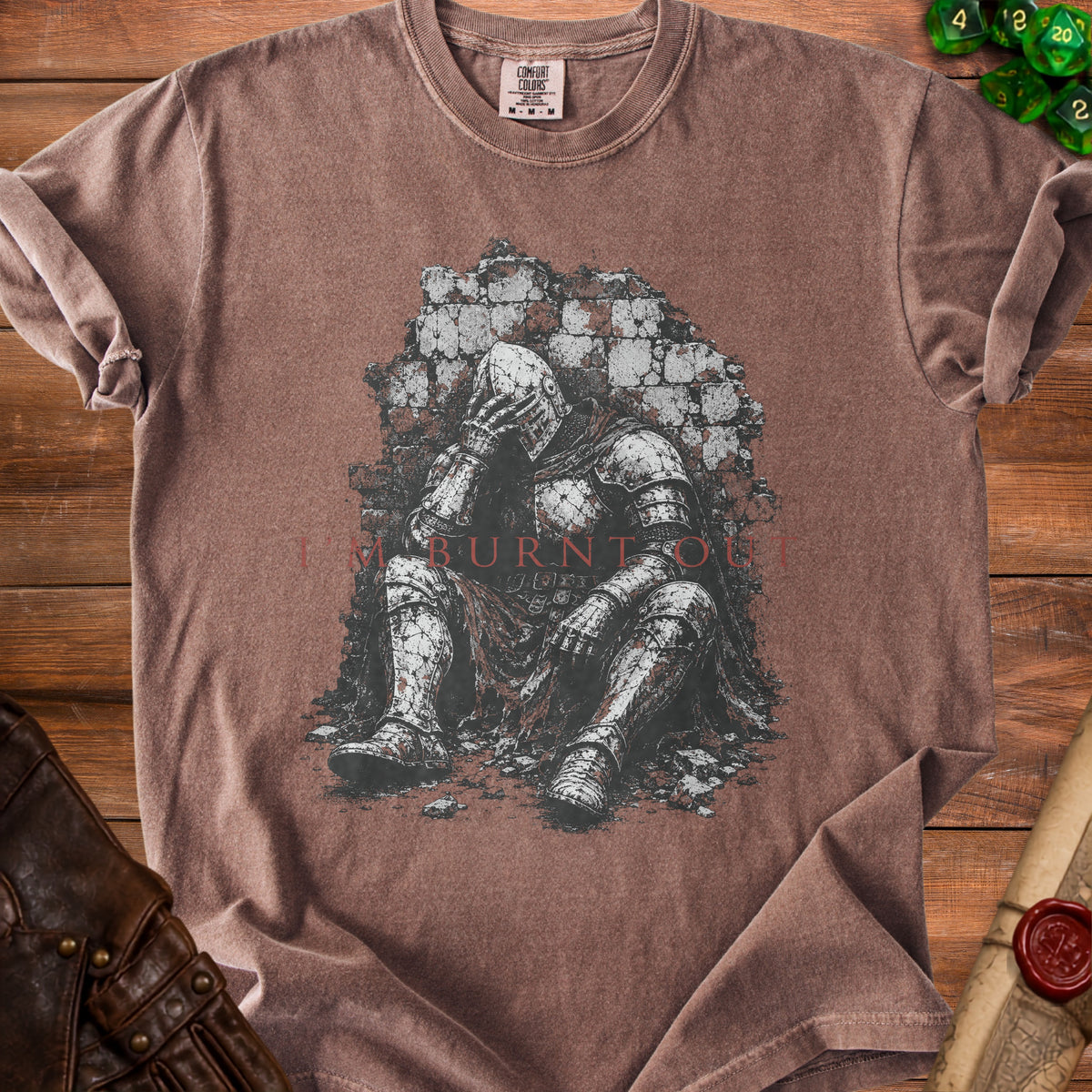 Brown t-shirt with graphic of knight sitting against brick wall, text "I'M BURNT OUT".