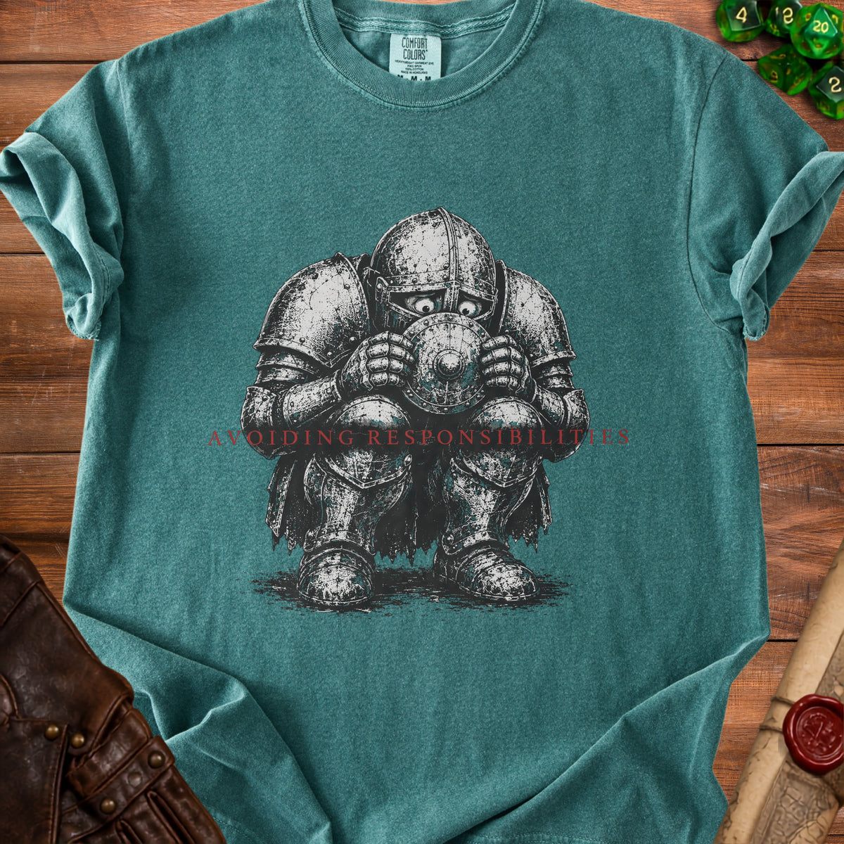 T-shirt graphic of a knight in armor holding a shield, with text "AVOIDING RESPONSIBILITIES".