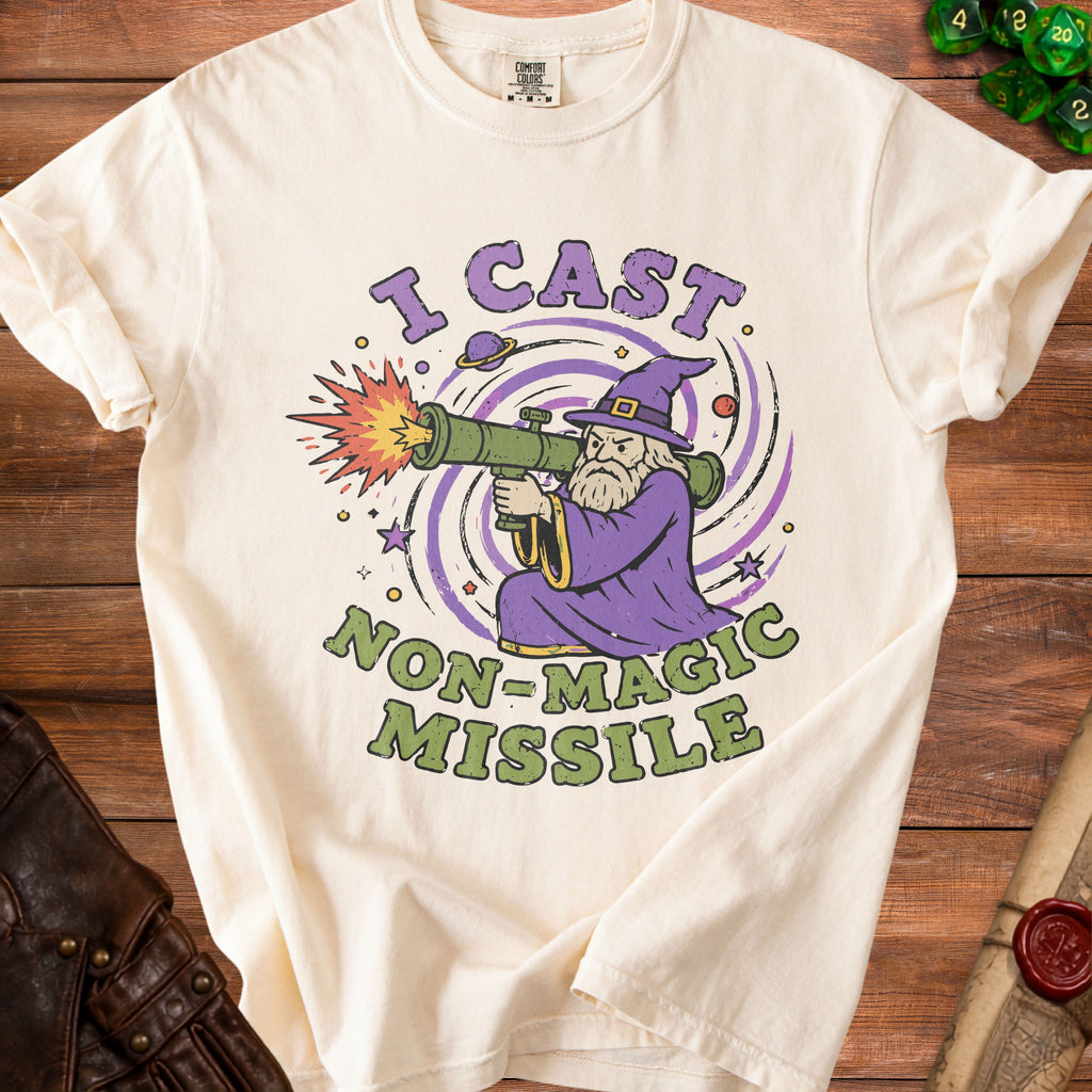 Cream t-shirt with graphic of wizard firing a rocket launcher, text "I CAST NON-MAGIC MISSILE".