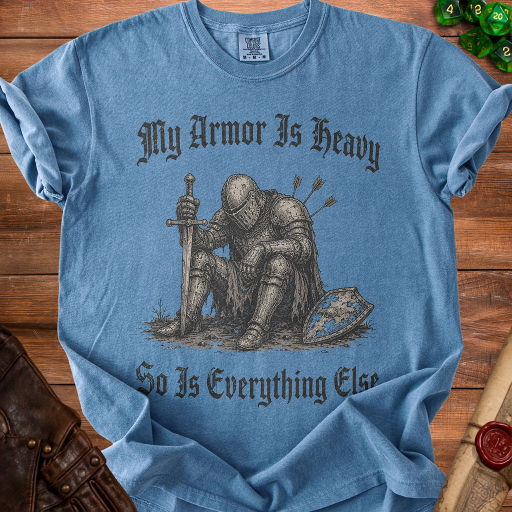 Blue t-shirt with distressed graphic of knight and text "My Armor Is Heavy, So Is Everything Else".