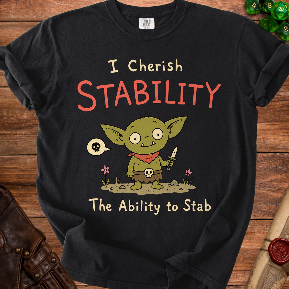 Black t-shirt with a cartoon goblin saying "I Cherish Stability The Ability to Stab".