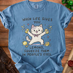 Blue t-shirt with a cartoon cat squeezing lemons and text "When life gives you lemons, squeeze them in people's eyes."