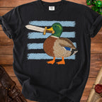 Duck with sword held in beak on black t-shirt with blue striped background.