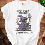 White t-shirt with graphic of black cat wizard, saying "Hop up out the bed turn my swag on".