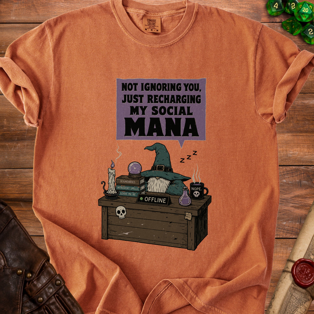 Orange t-shirt with graphic: "Not ignoring you, just recharging my social mana."
