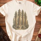 Cream t-shirt with wizard, goblin, and monster treasure chest in redwood forest graphic.