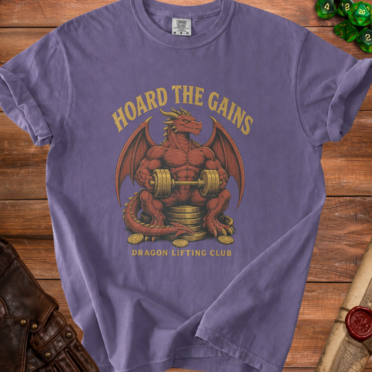 Purple t-shirt with a red dragon lifting weights, text "HOARD THE GAINS" and "DRAGON LIFTING CLUB".