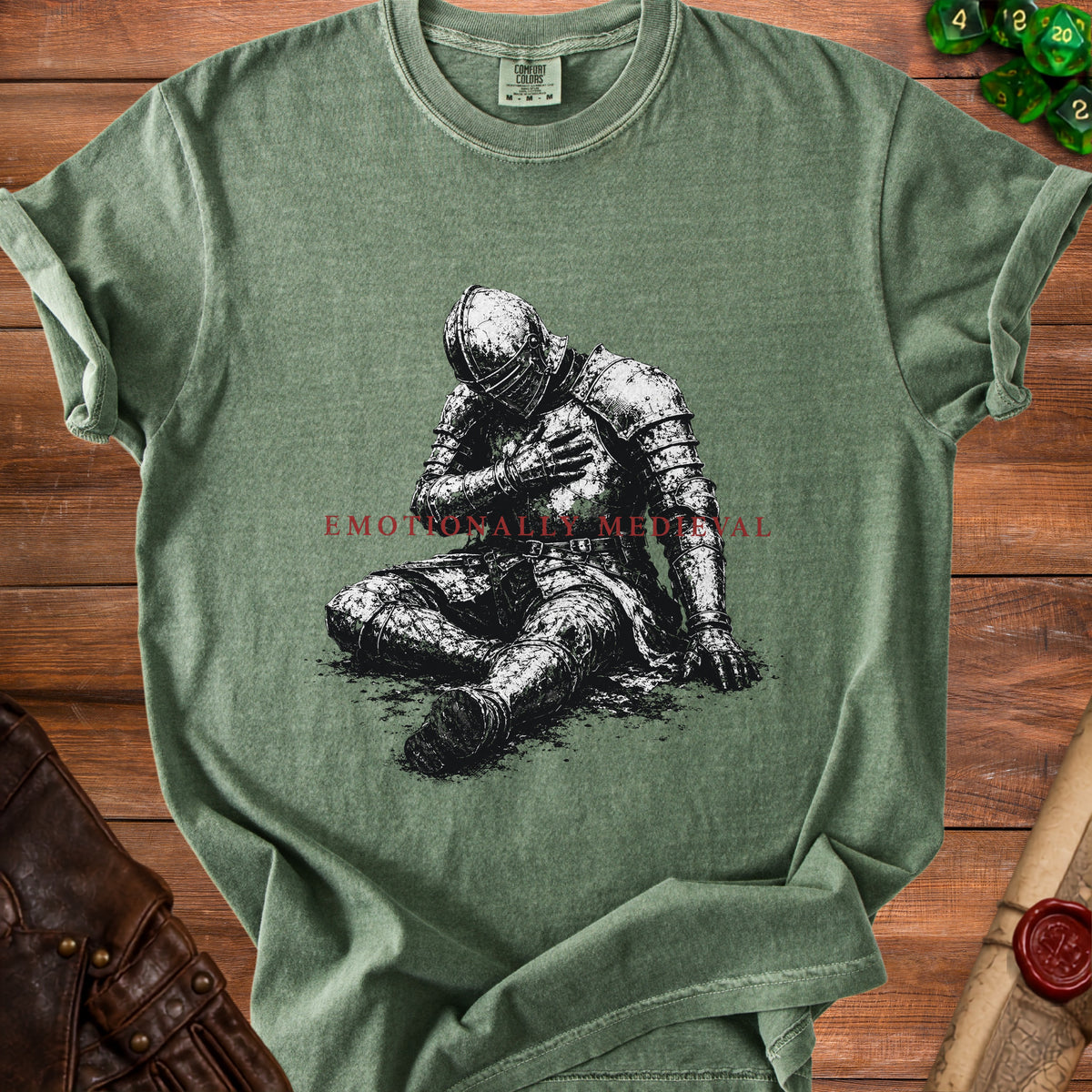 T-shirt with black ink illustration of a knight sitting, text "EMOTIONALLY MEDIEVAL"