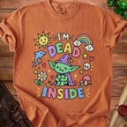 Orange t-shirt with graphic of a green creature and the text "I'm Dead Inside".