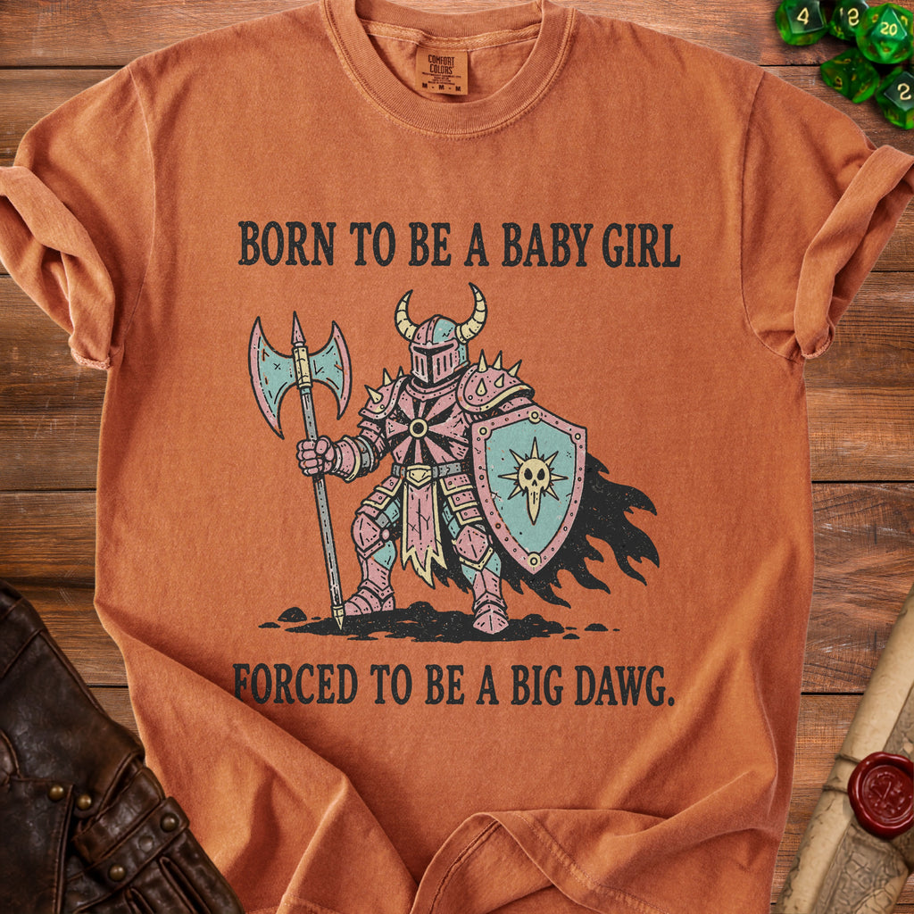 Orange t-shirt with knight graphic and text "Born to be a baby girl forced to be a big dawg."