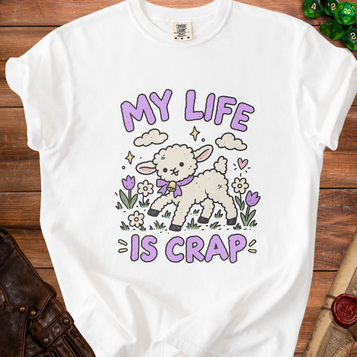 White t-shirt with a cartoon lamb and the text "MY LIFE IS CRAP".